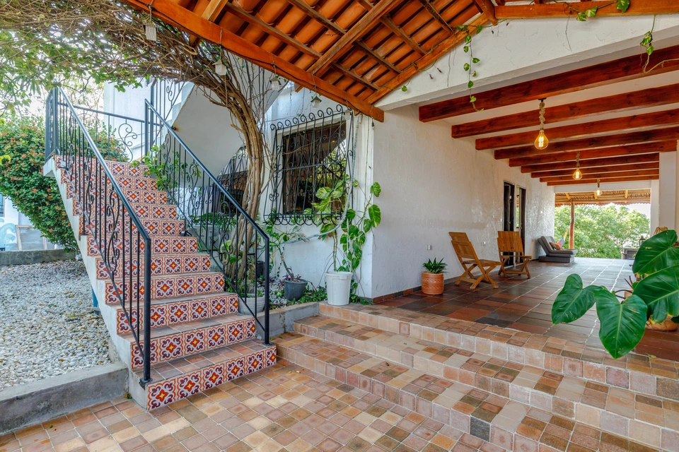 Decorative tiled stairs and covered entrance at Puerto Beach House