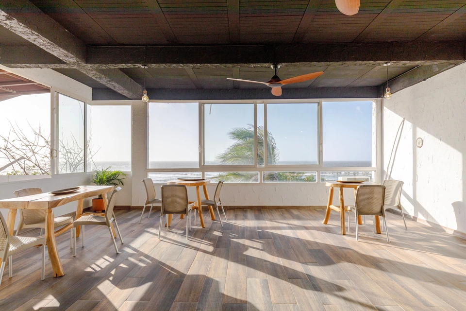Salon seating beside the ocean-facing windows