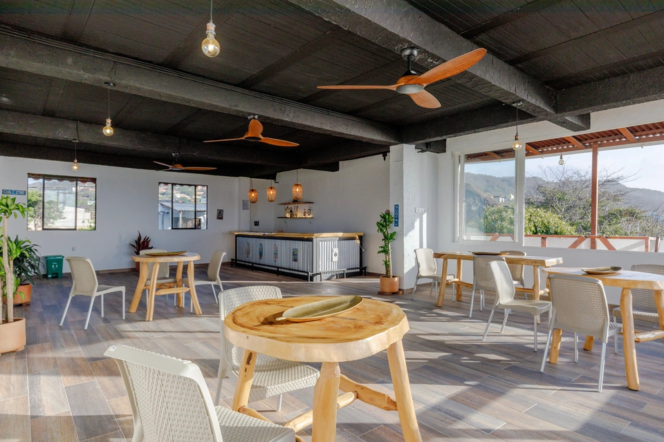 Alternate wide view of the salon seating and bar
